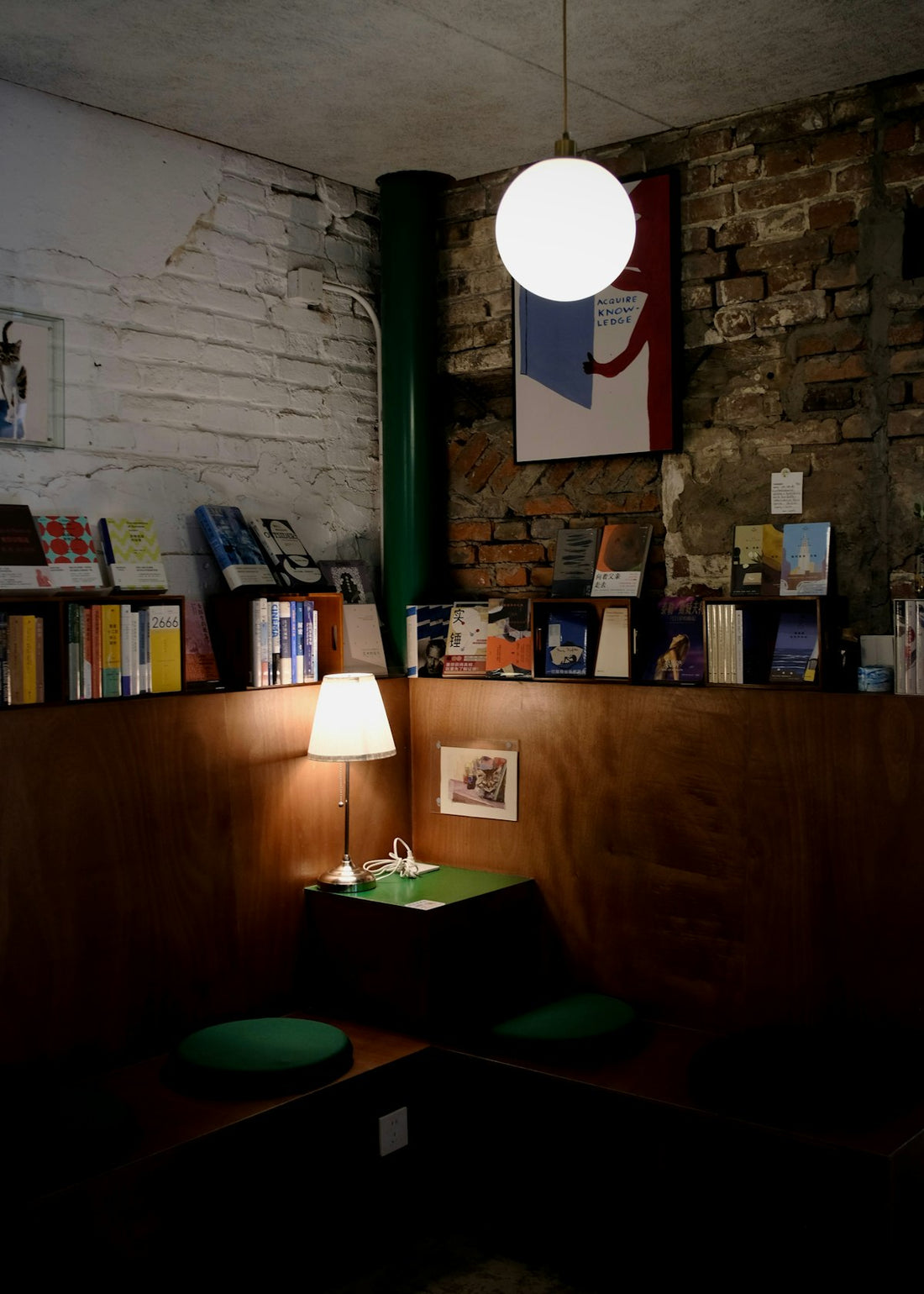 Cozy reading nook with books and a lamp